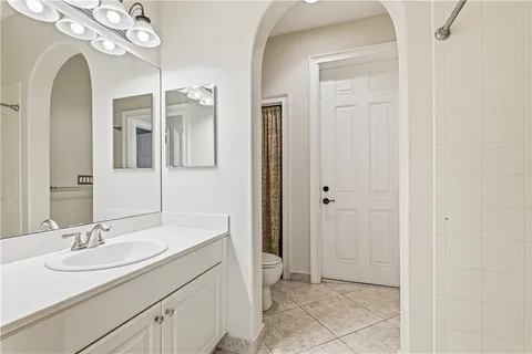 a balcony with furniture and a potted plant