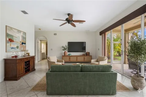 a view of a livingroom with furniture and a potted plant