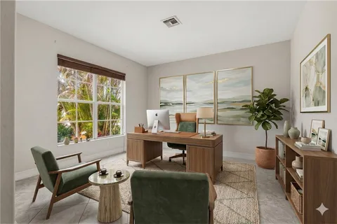a dining room with furniture a chandelier and window