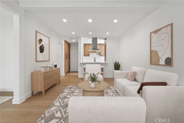 a living room with furniture white walls and white walls