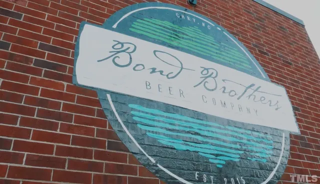 a view of a patio with table and chairs and potted plants