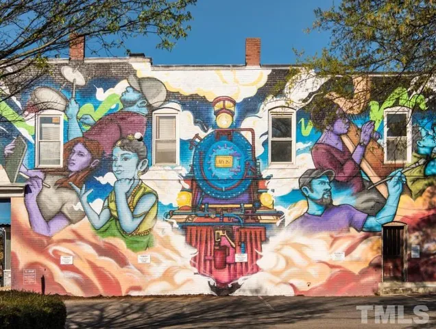 a view of a building with a window and tree in front of house