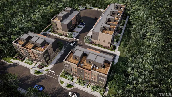 an aerial view of a house with a yard