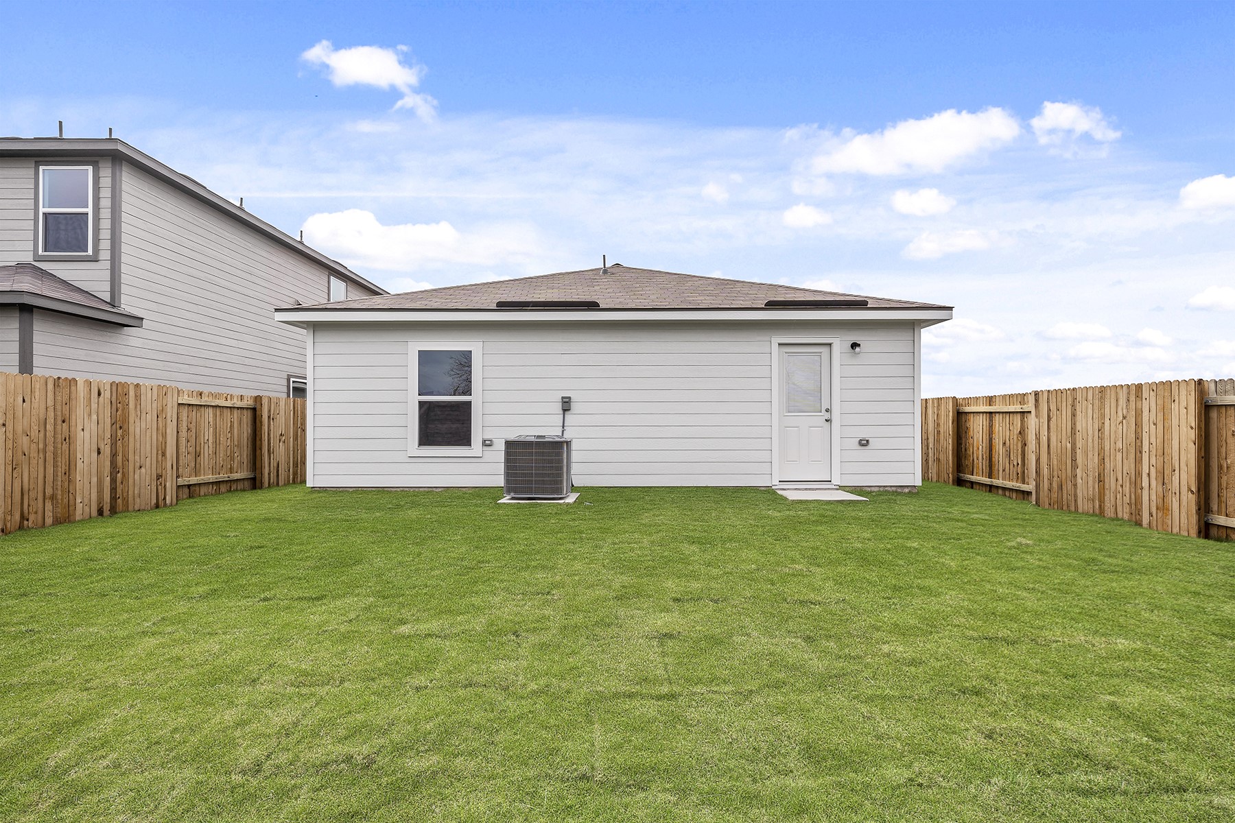 14604 Wahlbergs Way Elgin, TX 78621 - Photo 2 of 6 a view of a backyard space