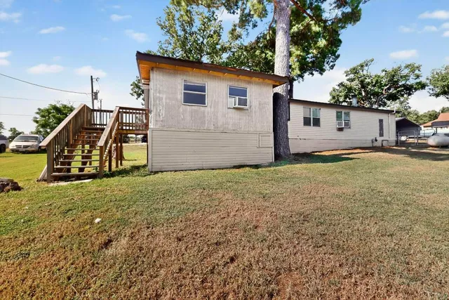 a view of a backyard of the house