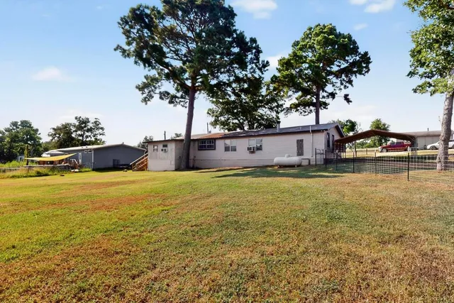 a house view with swimming pool