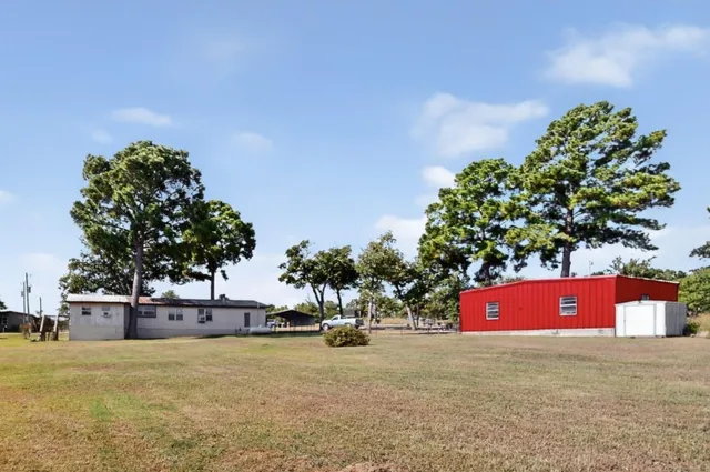 a front view of a house with a yard and a garage