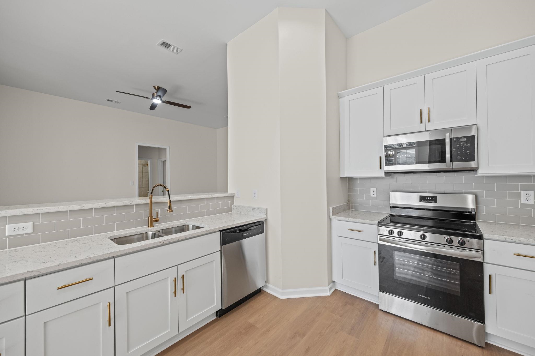 8670 Valmont Circle Memphis, TN 38016 - Photo 13 of 33 Kitchen with stainless steel appliances and decorative backsplash