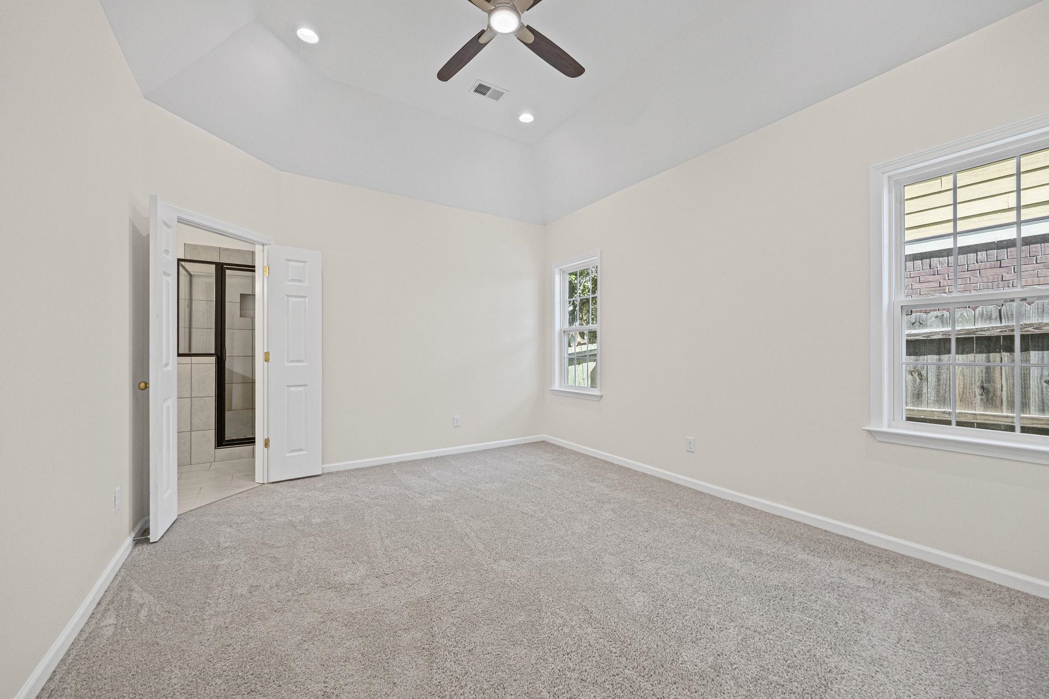 8670 Valmont Circle Memphis, TN 38016 - Photo 22 of 33 Unfurnished room featuring light colored carpet, recessed lighting, and ceiling fan