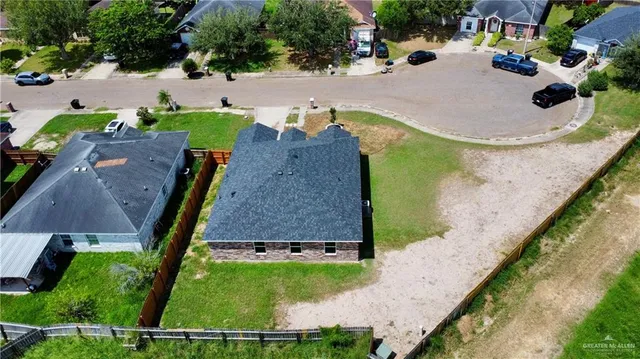 an aerial view of a house with outdoor space