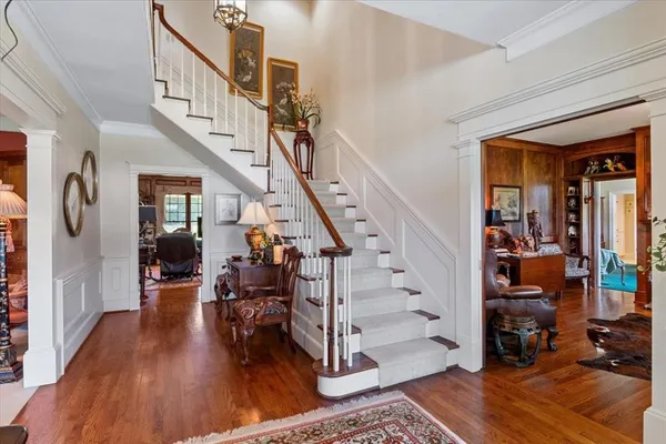 a view of entryway livingroom and hall with wooden floor