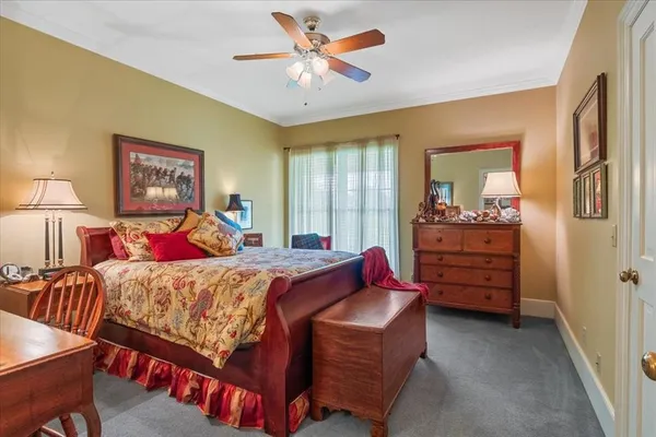 a bed room with a bed and a chandelier
