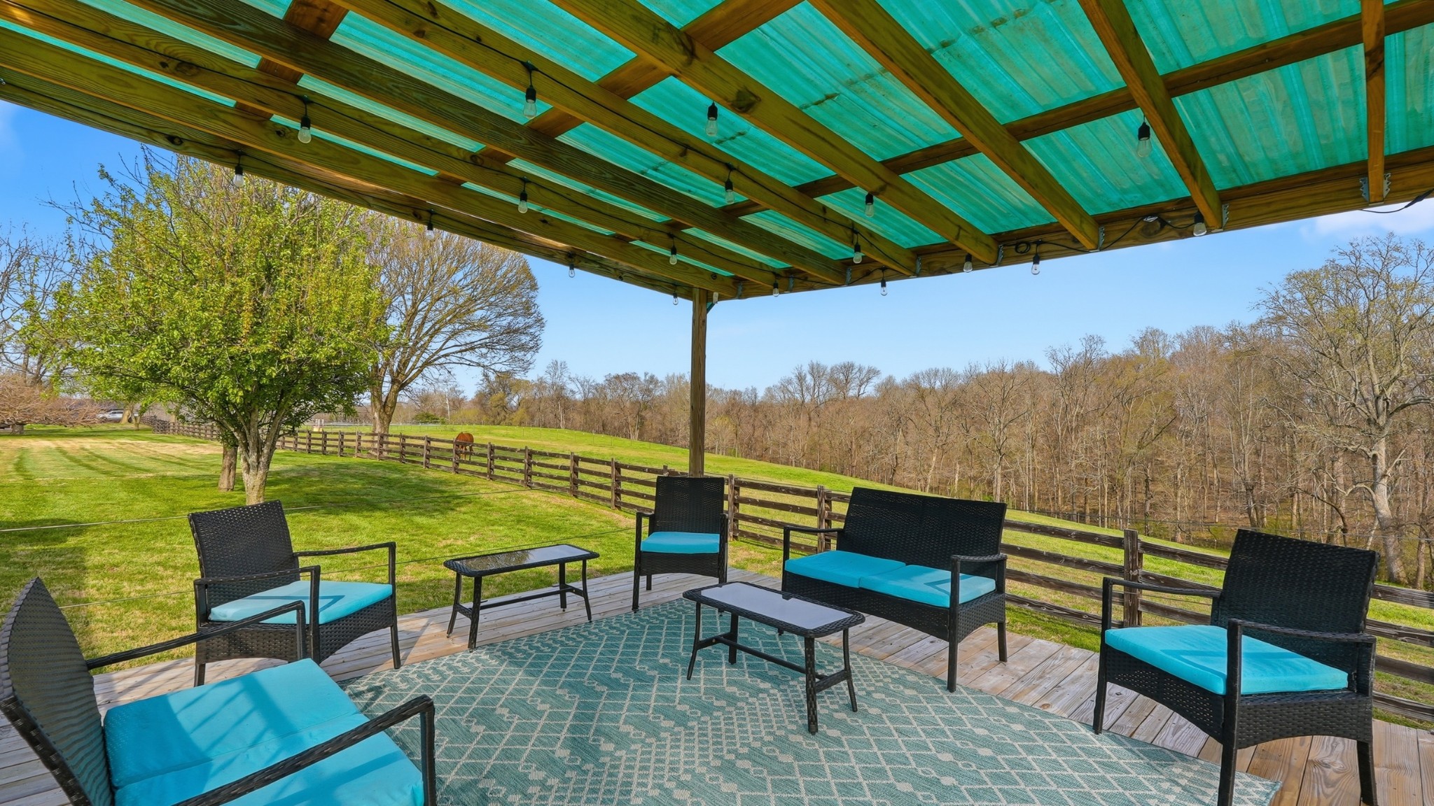 2820 Lockertsville Road Ashland City, TN 37015 - Photo 14 of 47 a view of an outdoor sitting area with furniture and umbrella