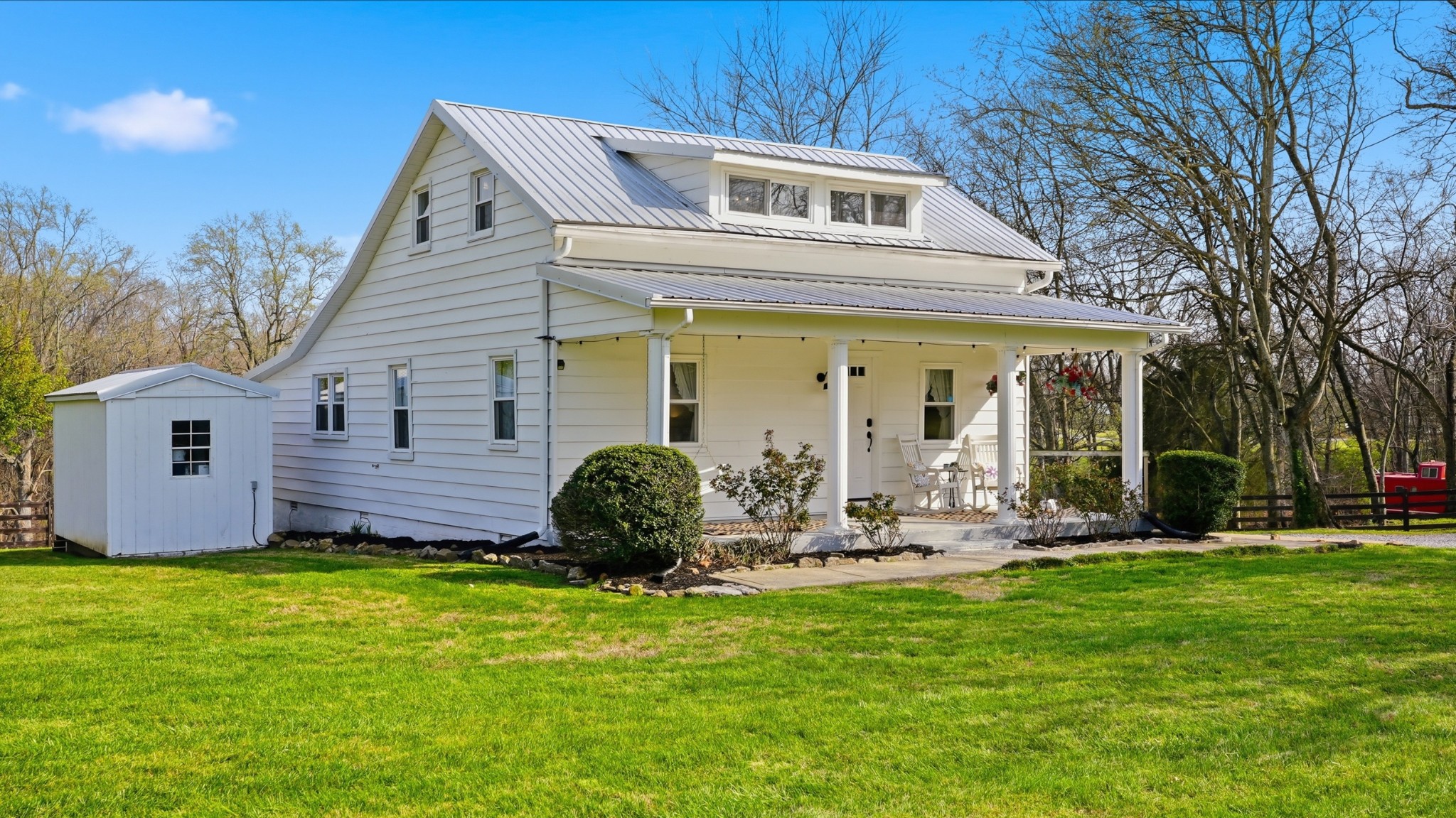 2820 Lockertsville Road Ashland City, TN 37015 - Photo 5 of 47 a front view of a house with garden and porch