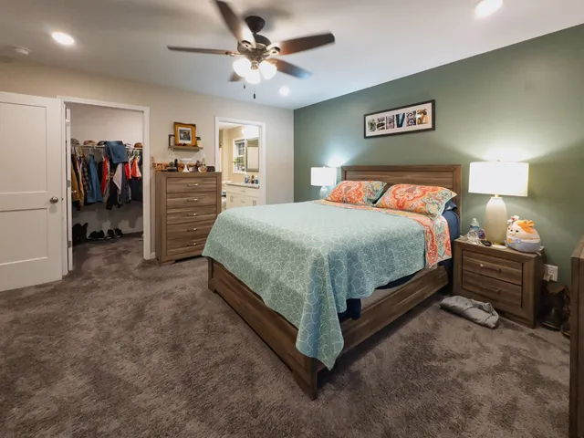 a bedroom with a bed and a walk in closet