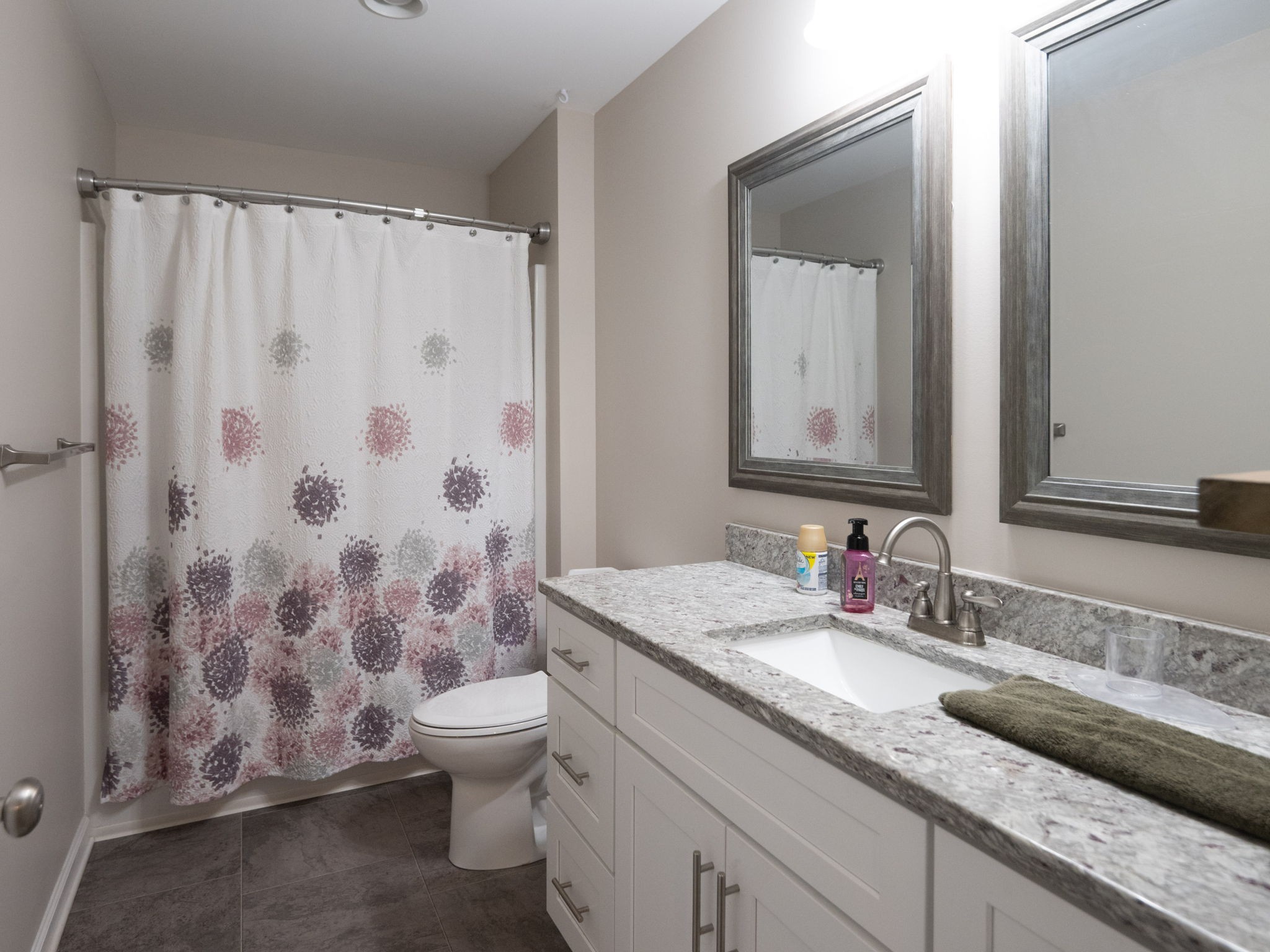 14 Lost Creek Road Carthage, TN 37030 - Photo 16 of 28 a bathroom with a granite countertop sink a toilet and a mirror