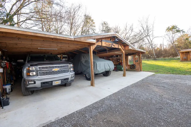 a backyard of a house with table and chairs