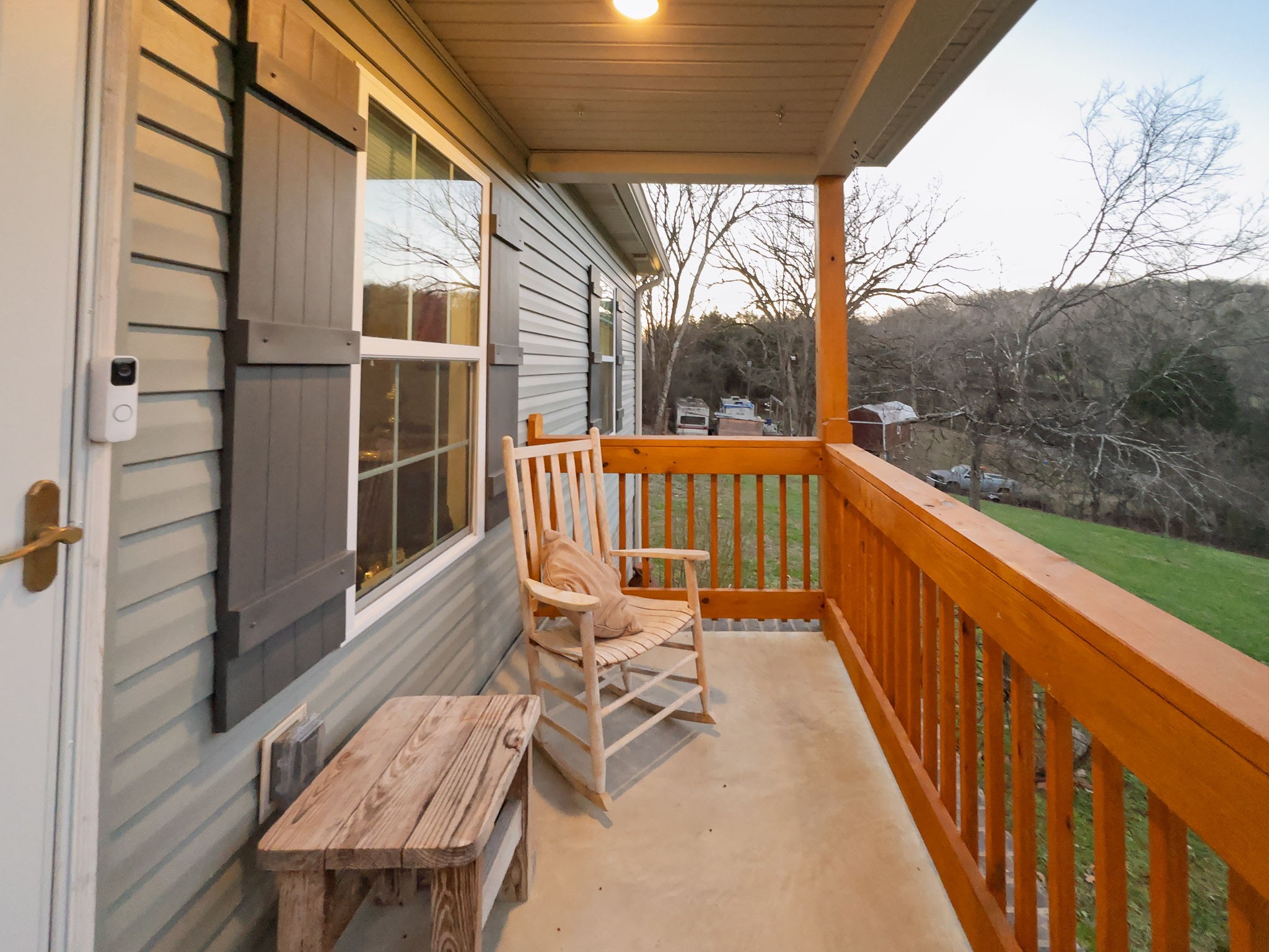 14 Lost Creek Road Carthage, TN 37030 - Photo 3 of 28 a view of balcony with wooden floor and outdoor seating