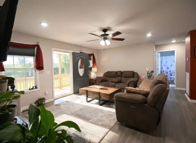 a living room with furniture and a large window