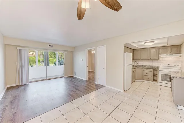 a view of a kitchen with wooden floor