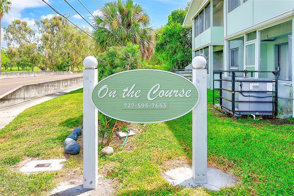 1329 Drew Street, Unit 4 Clearwater, FL 33755 - Photo 21 of 34 a sign on the side of the building