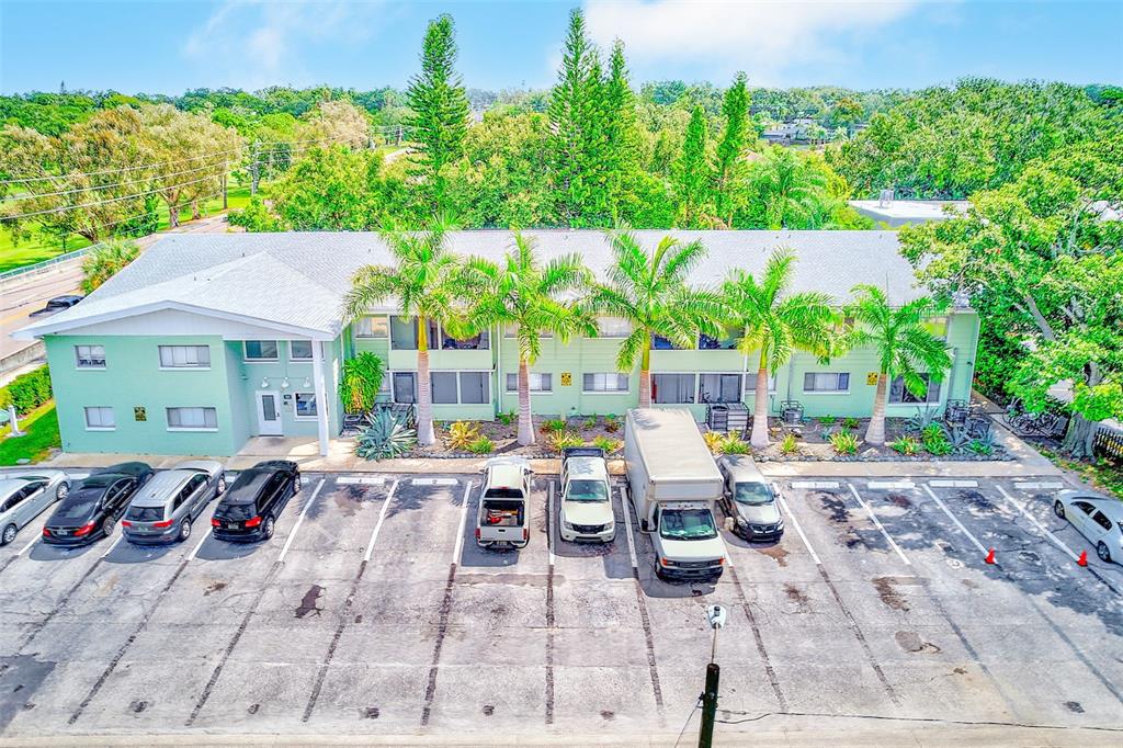 1329 Drew Street, Unit 4 Clearwater, FL 33755 - Photo 29 of 34 a view of backyard of house with outdoor seating
