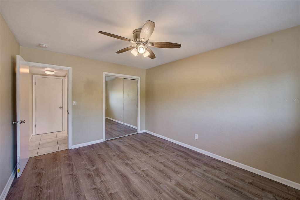 1329 Drew Street, Unit 4 Clearwater, FL 33755 - Photo 5 of 34 a view of an empty room and wooden floor