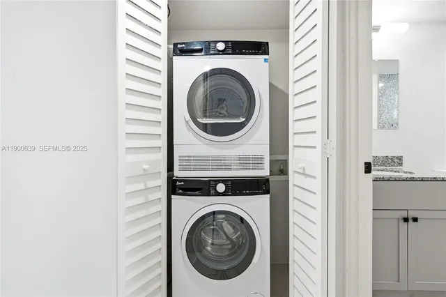 a view of a hallway with washer and dryer
