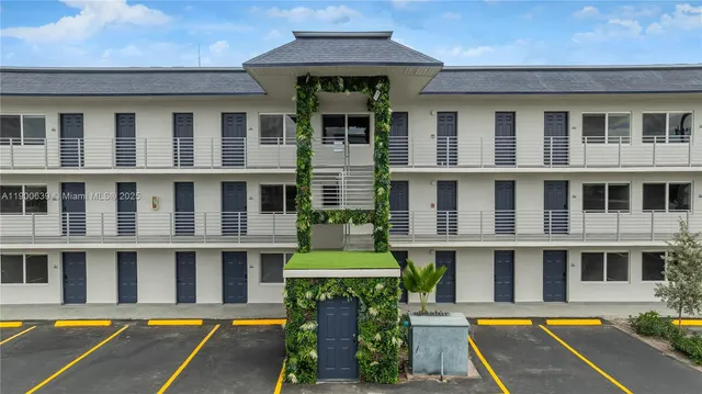 a front view of a building with swimming pool