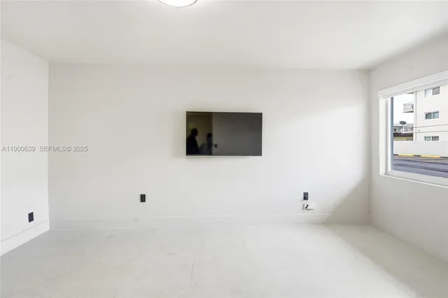 a living room with a flat screen tv