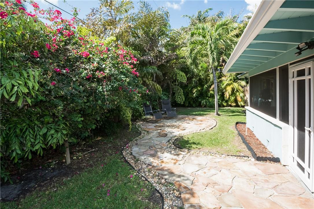 10 Minnetonka Road Sea Ranch Lakes, FL 33308 - Photo 23 of 36 Back yard with luscious landscaping