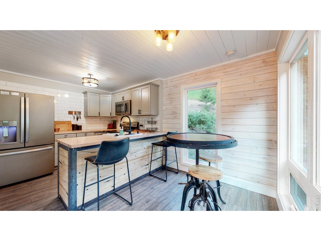 1268 Spring Valley Road Bellvue, CO 80512 - Photo 12 of 33 a kitchen with a table and chairs