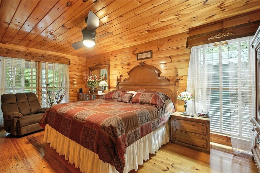 59 Bear Track Trail Morganton, GA 30560 - Photo 14 of 37 a bed sitting in a bedroom next to a window