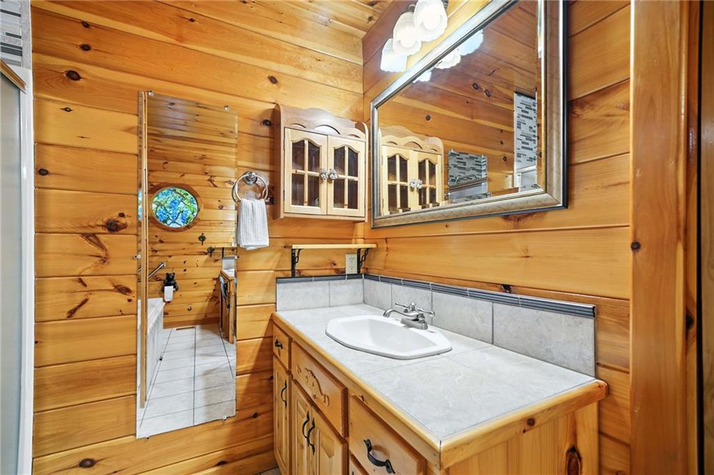 59 Bear Track Trail Morganton, GA 30560 - Photo 16 of 37 a bathroom with a sink and mirror