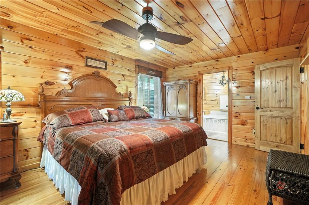 59 Bear Track Trail Morganton, GA 30560 - Photo 17 of 37 a bedroom with a bed and wooden floor