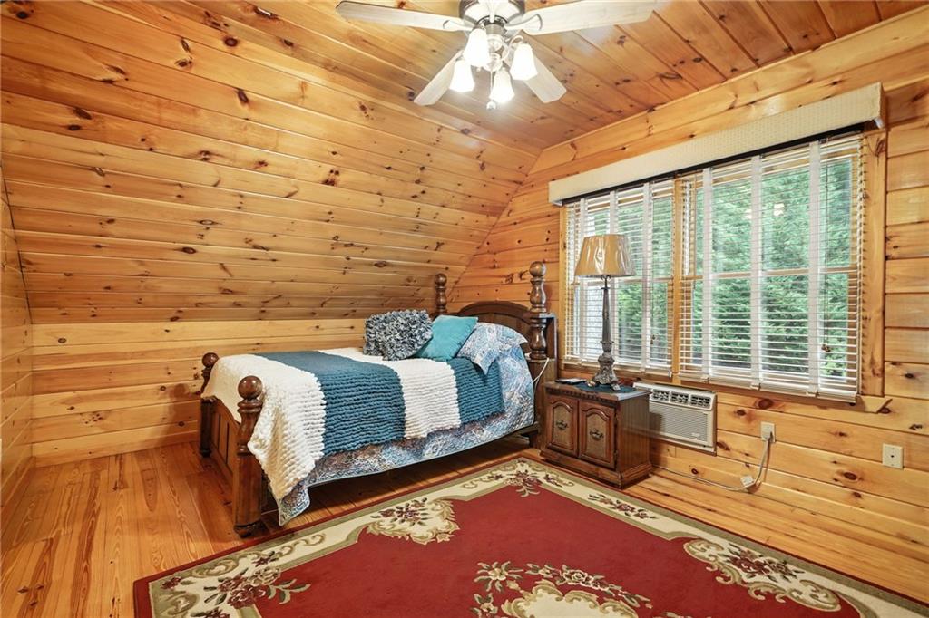 59 Bear Track Trail Morganton, GA 30560 - Photo 21 of 37 a bedroom with a bed and wooden floor