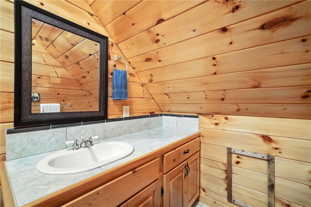 59 Bear Track Trail Morganton, GA 30560 - Photo 22 of 37 a bathroom with a sink and mirror