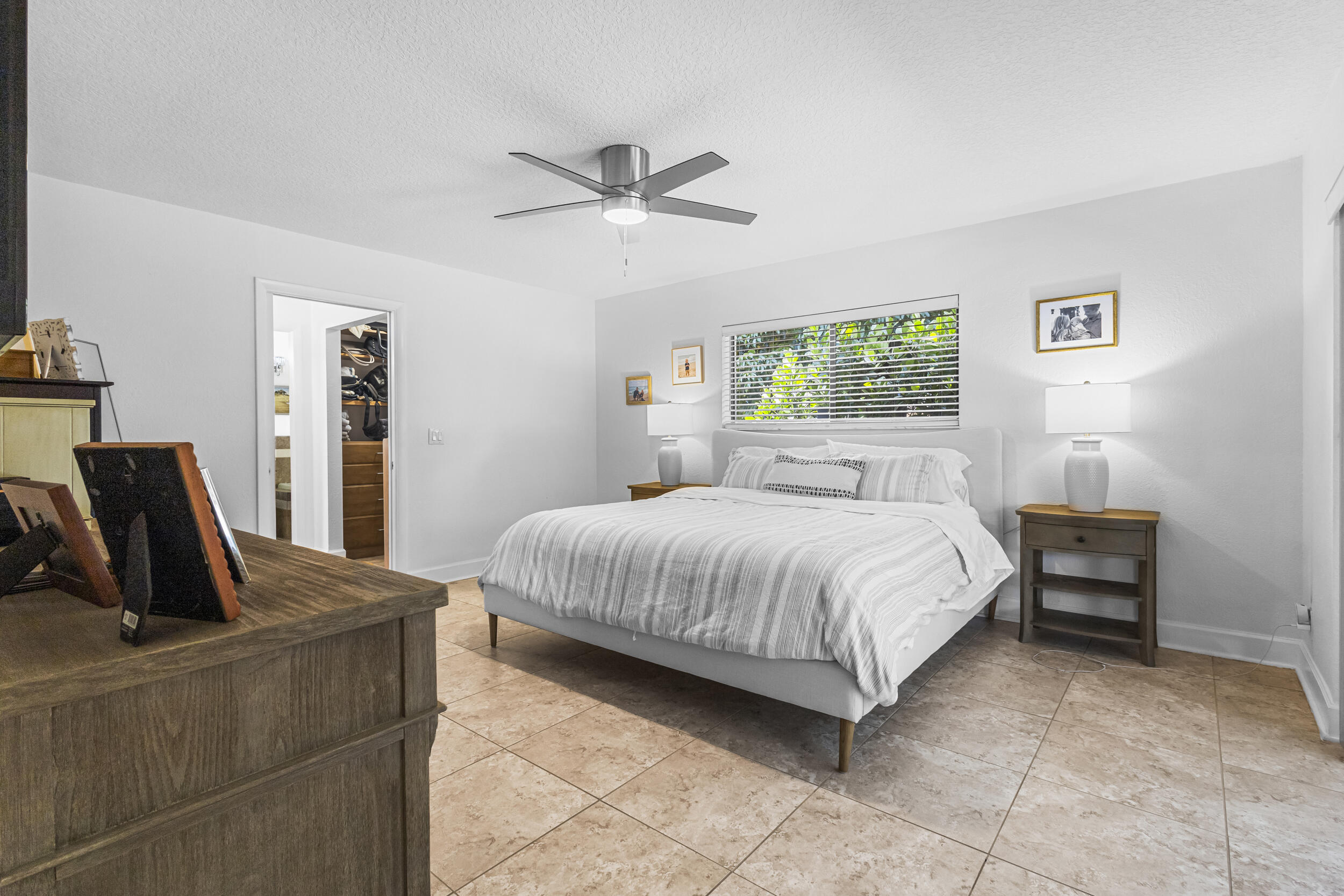1948 Southwest 36th Avenue Delray Beach, FL 33445 - Photo 20 of 40 a bedroom with a bed and dresser