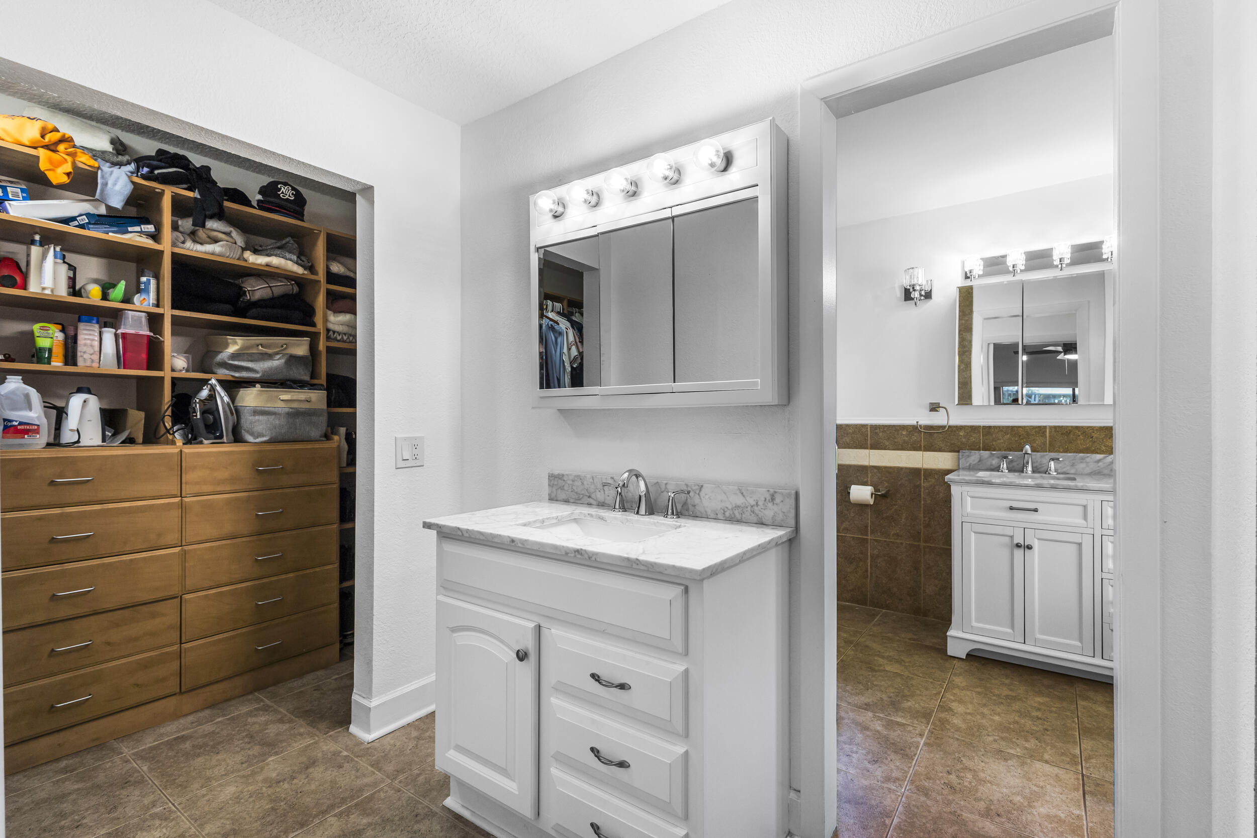 1948 Southwest 36th Avenue Delray Beach, FL 33445 - Photo 23 of 40 a bathroom with a sink double vanity and a mirror
