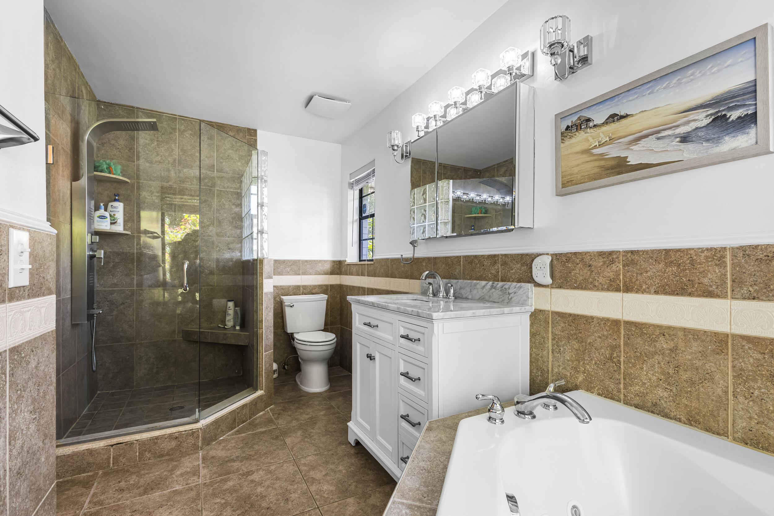 1948 Southwest 36th Avenue Delray Beach, FL 33445 - Photo 25 of 40 a bathroom with a sink and a mirror