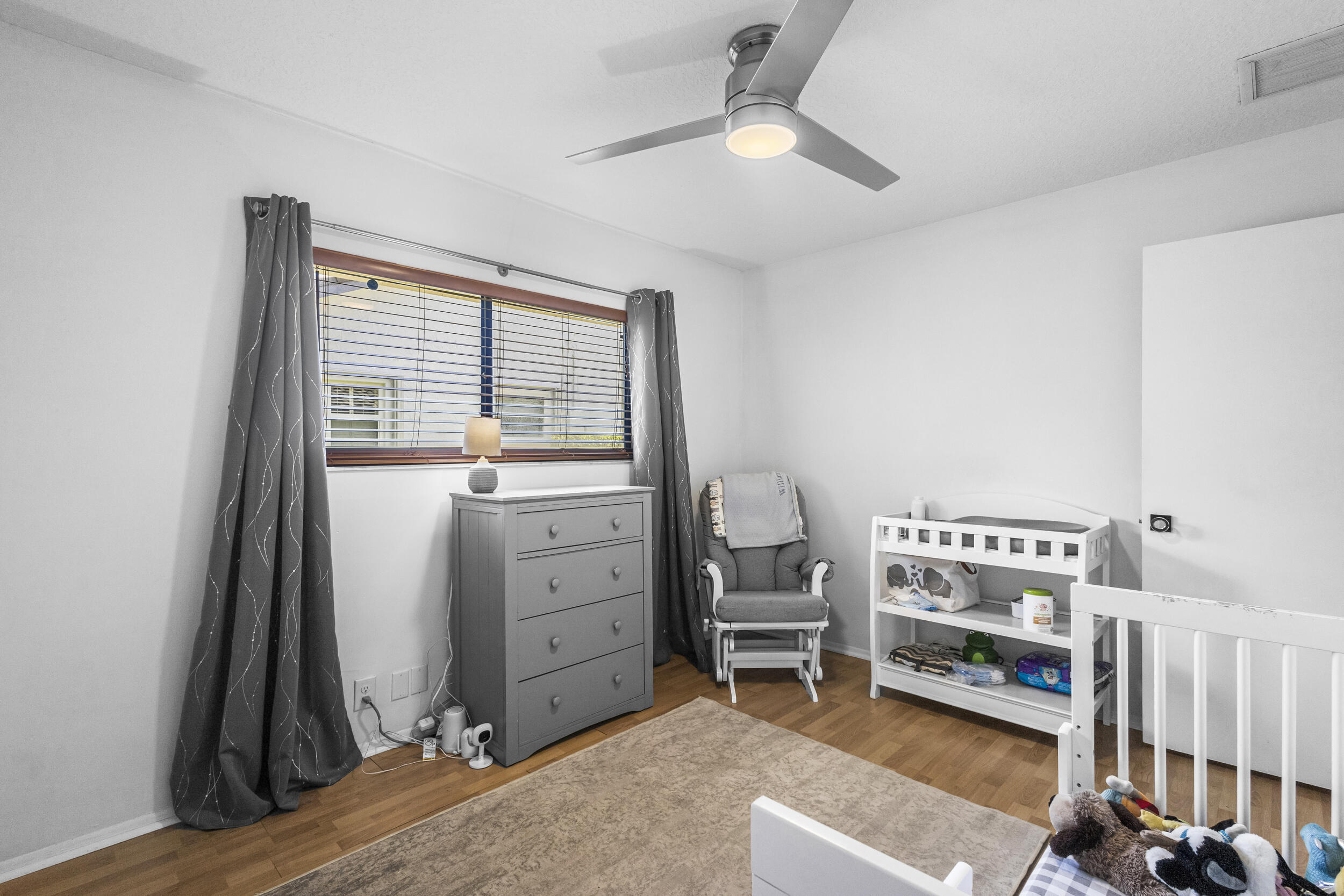 1948 Southwest 36th Avenue Delray Beach, FL 33445 - Photo 30 of 40 a view of a bedroom with workspace and windows