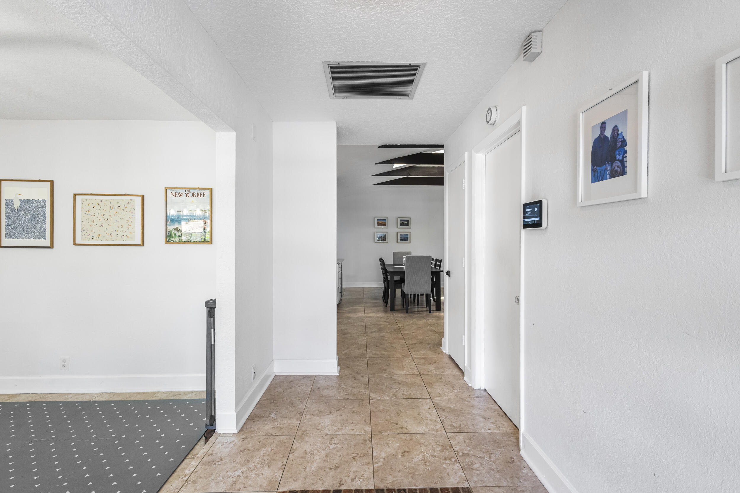 1948 Southwest 36th Avenue Delray Beach, FL 33445 - Photo 6 of 40 a view of a hallway with living room and wooden floor