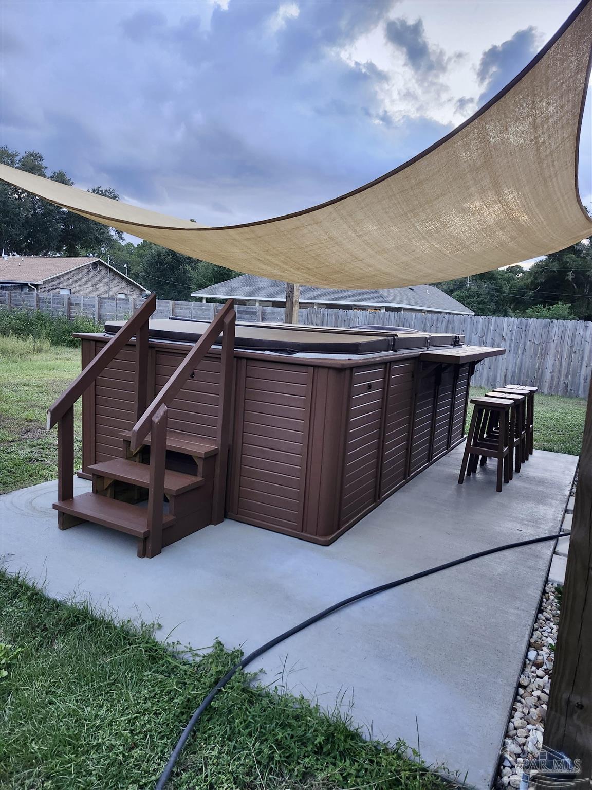 10425 Tanton Road Pensacola, FL 32506 - Photo 13 of 14 a view of a terrace with furniture and a backyard