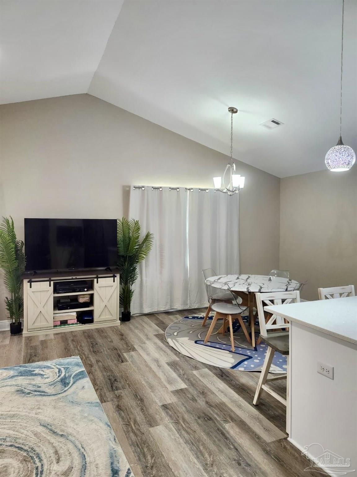 10425 Tanton Road Pensacola, FL 32506 - Photo 3 of 14 a workspace with furniture and a flat screen tv