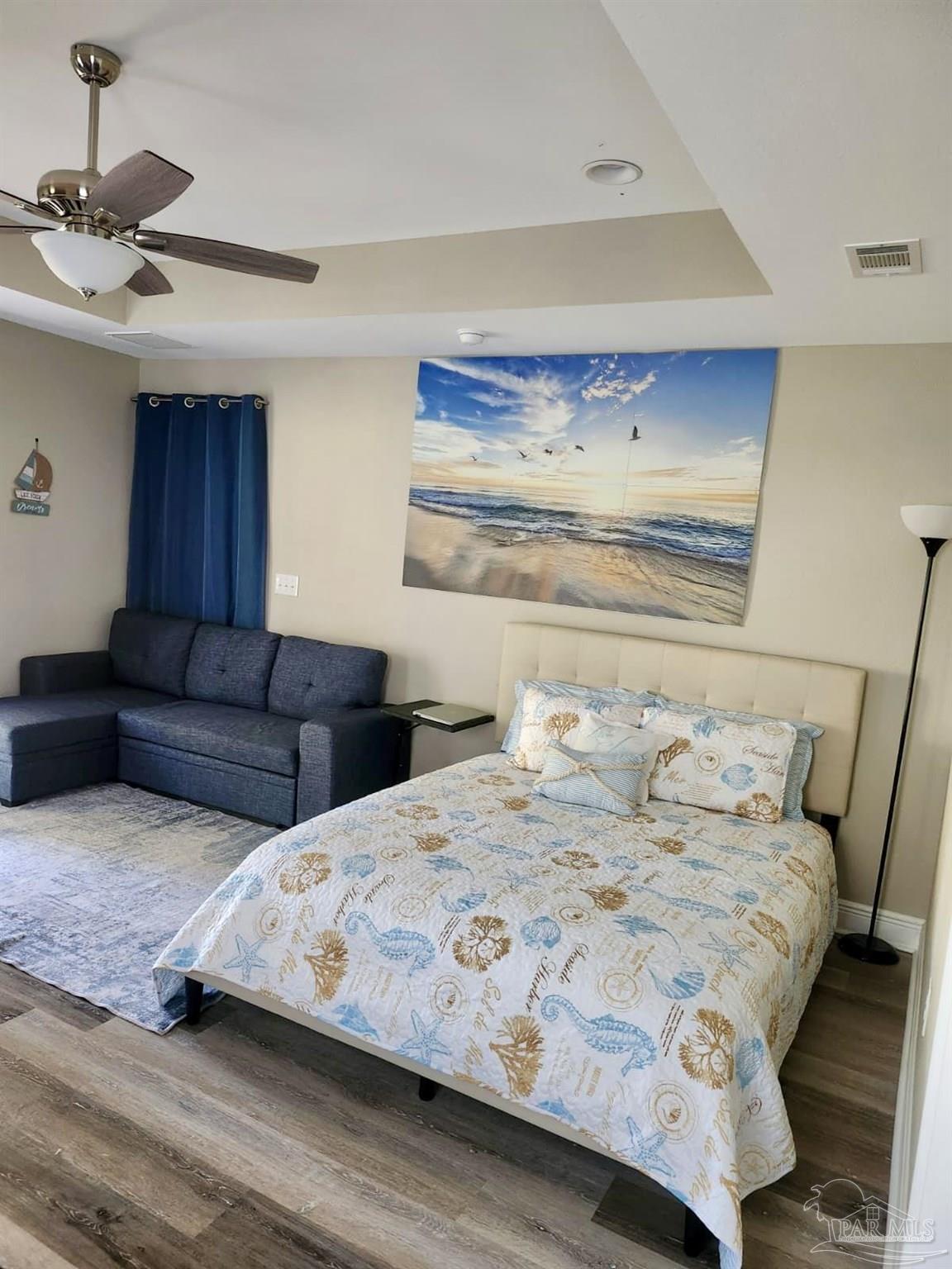 10425 Tanton Road Pensacola, FL 32506 - Photo 5 of 14 a bedroom with a bed and a night stand