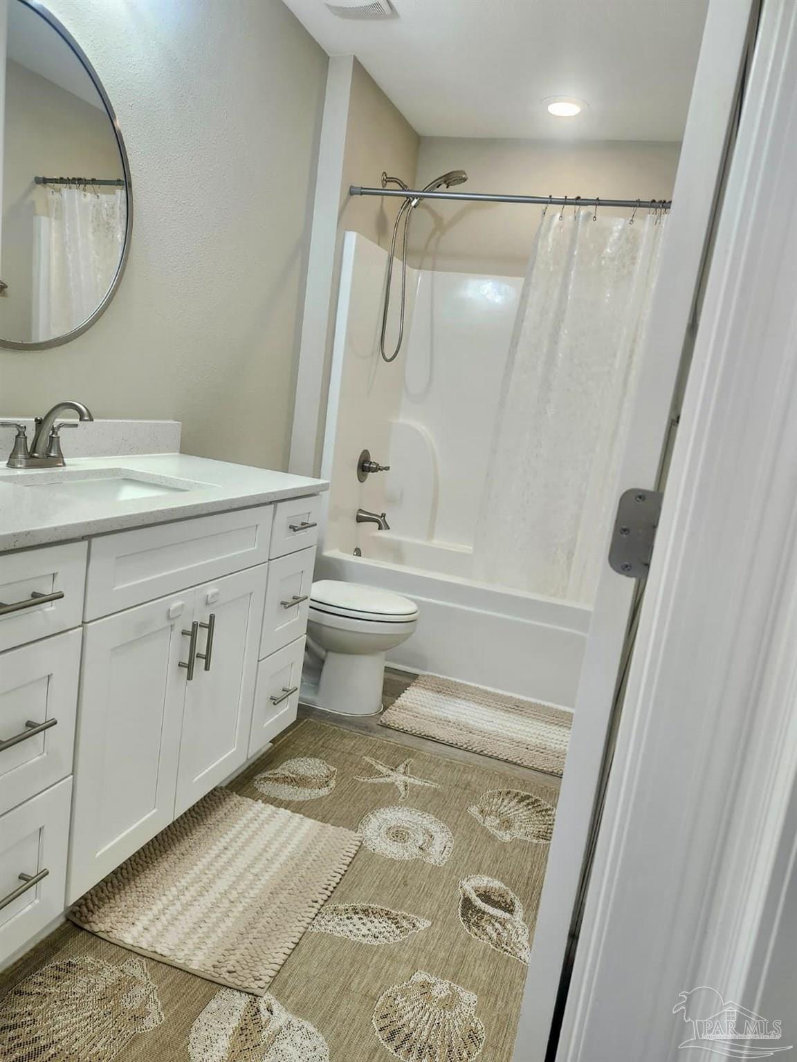 10425 Tanton Road Pensacola, FL 32506 - Photo 9 of 14 a bathroom with a granite countertop sink toilet and shower
