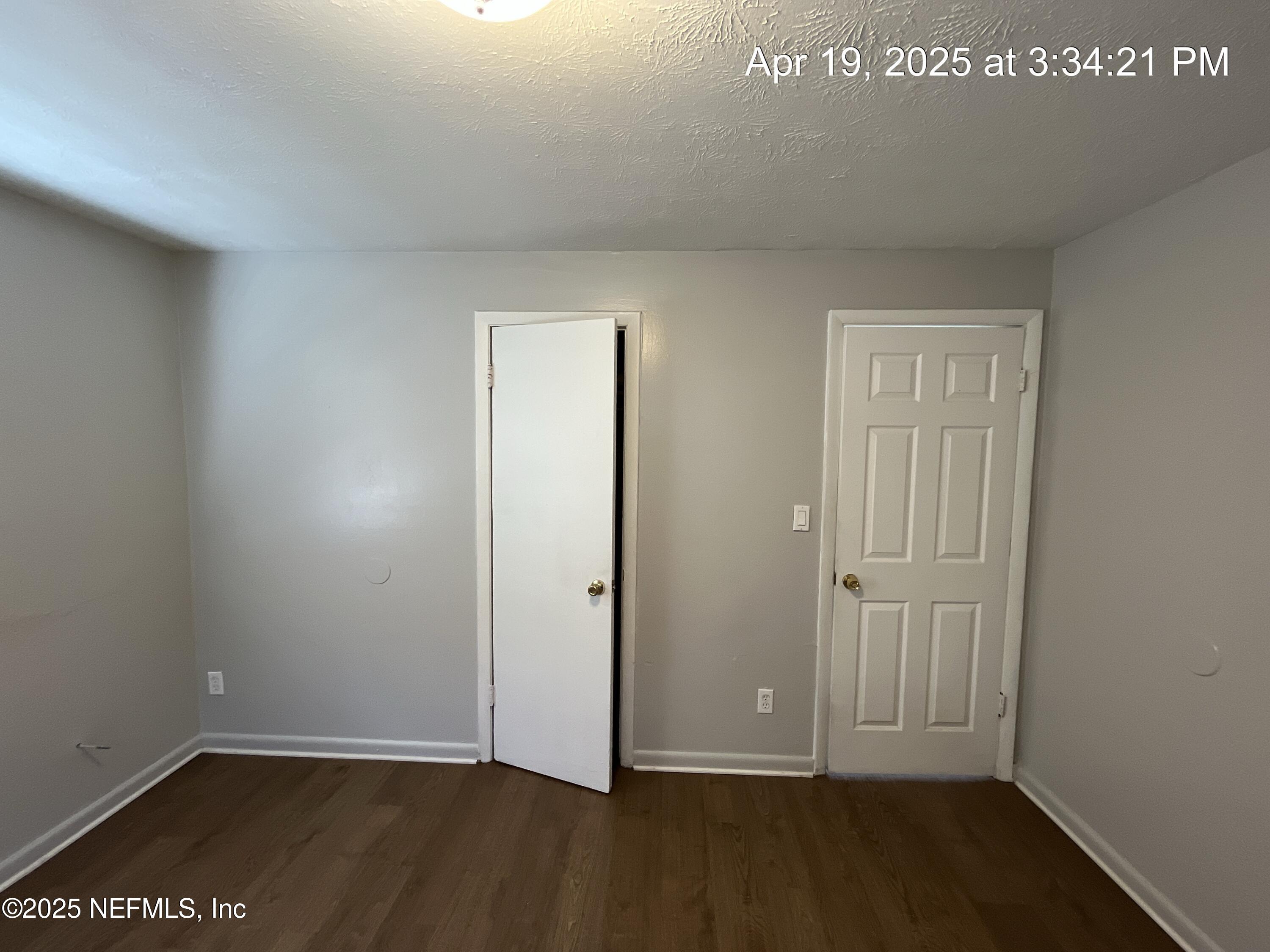 1616 West 36th Street Jacksonville, FL 32209 - Photo 3 of 7 an empty room with wooden floor
