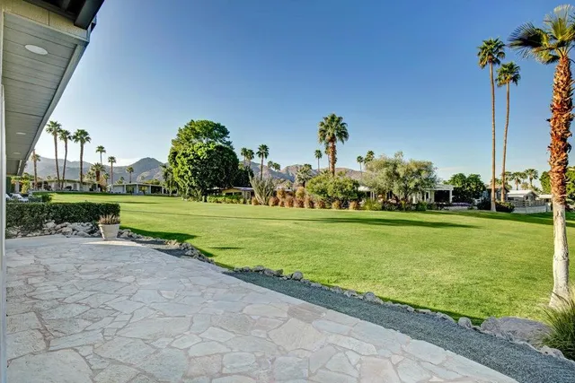 a childrens park with lots of trees and flowers