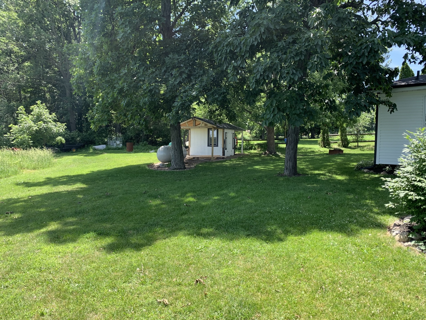 29060 Moose Range Road Sycamore, IL 60178 - Photo 25 of 28 a house that is sitting in the grass