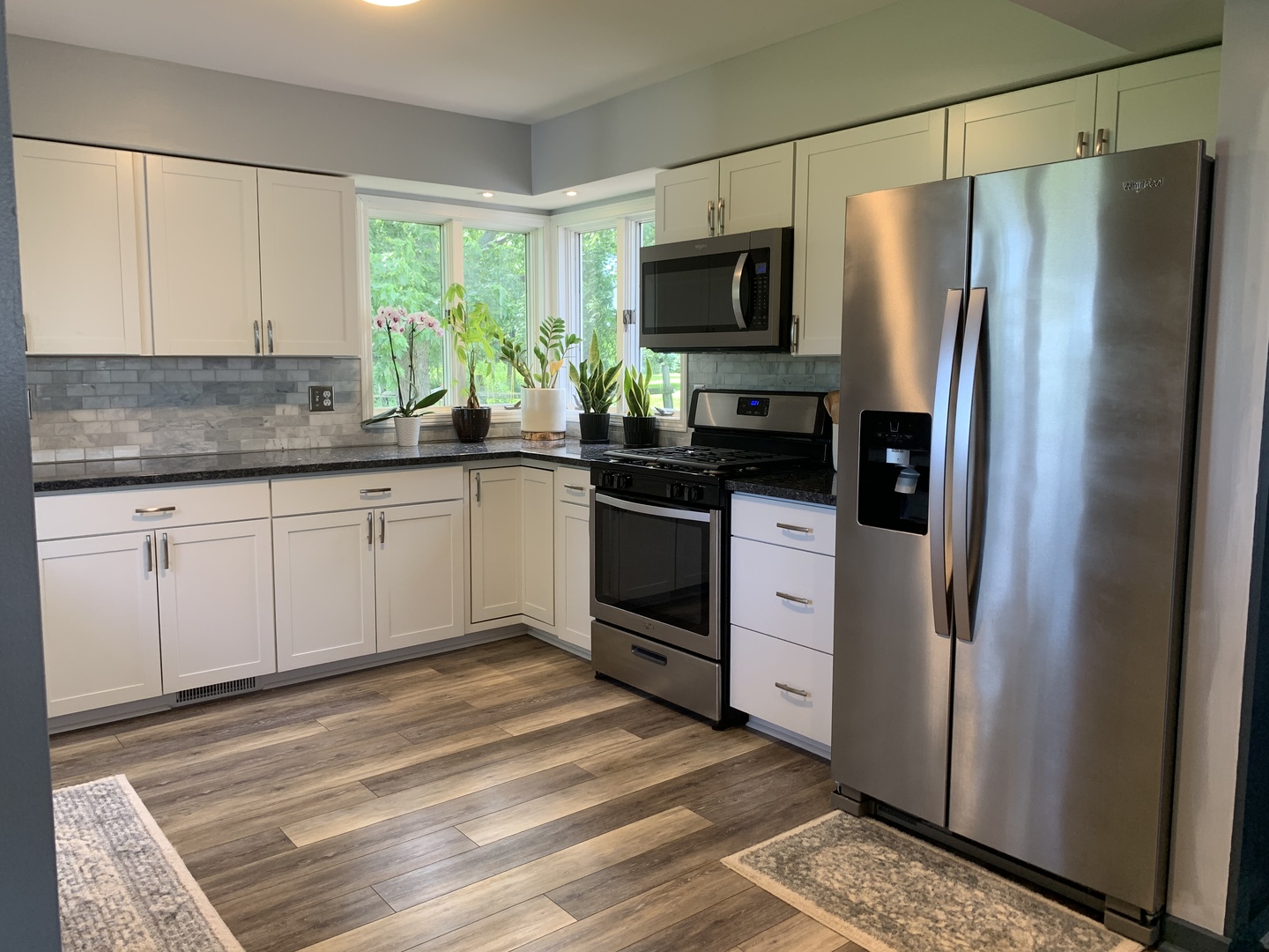 29060 Moose Range Road Sycamore, IL 60178 - Photo 6 of 28 a kitchen with stainless steel appliances granite countertop a refrigerator a stove a sink and a granite counter tops